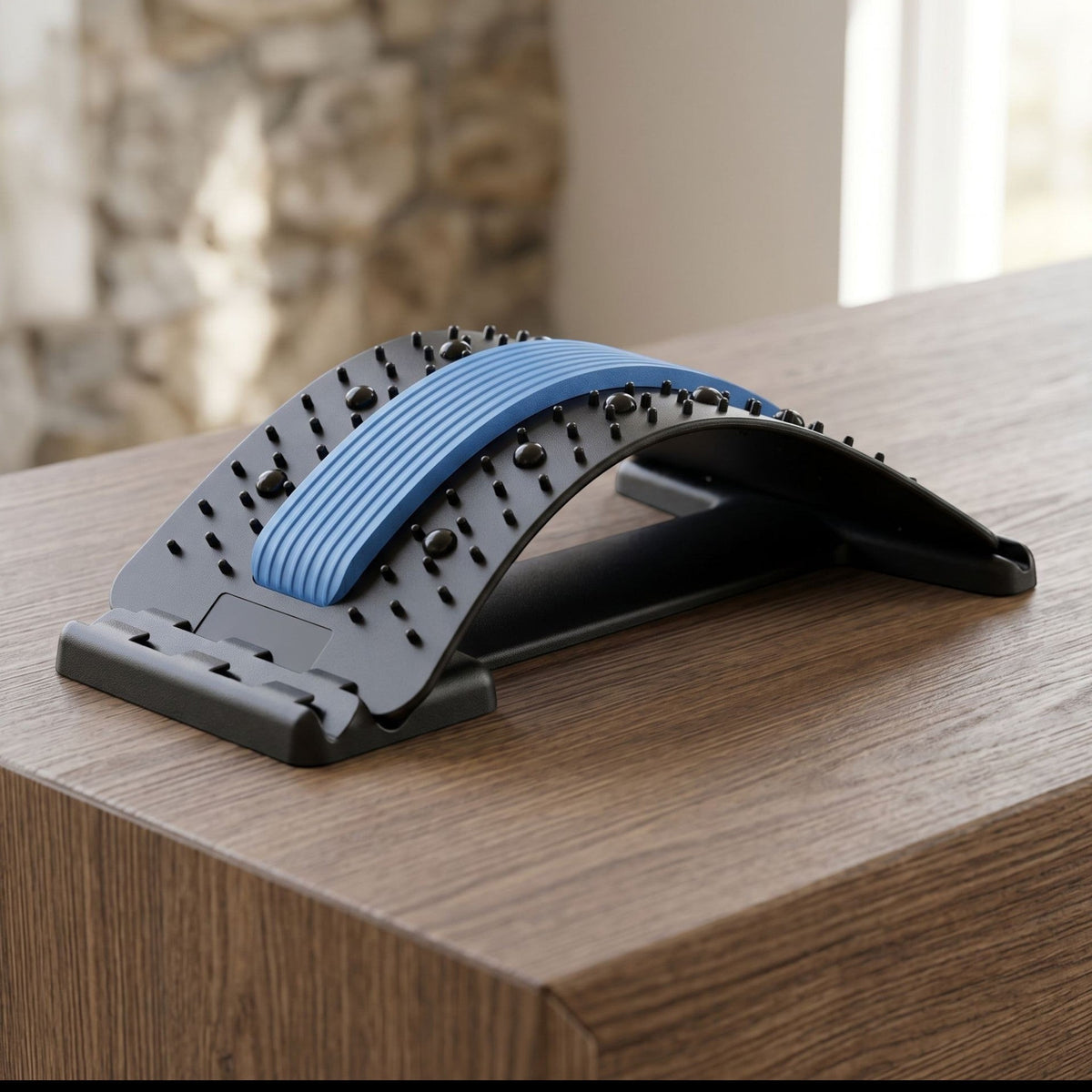 zero2cart black and blue lumbar back stretching support tool with massage nodes on a wooden surface