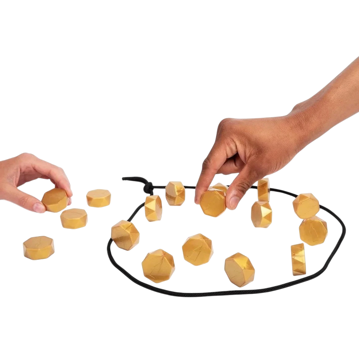 zero2cart magnetic strategy game with gold-colored faceted stones being placed by two players on a black rope board