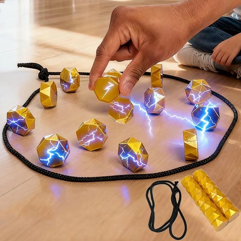 zero2cart magnetic strategy game with gold faceted stones and black rope boundary for family game night