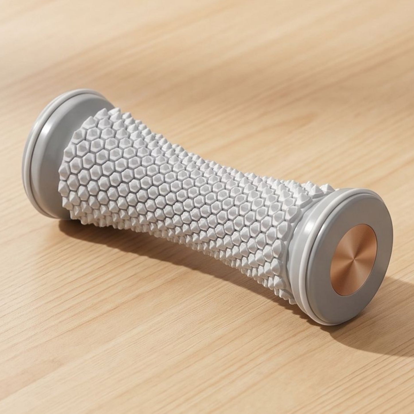 zero2cart manual foot massage roller with a textured white surface and metallic copper accents on a wooden table