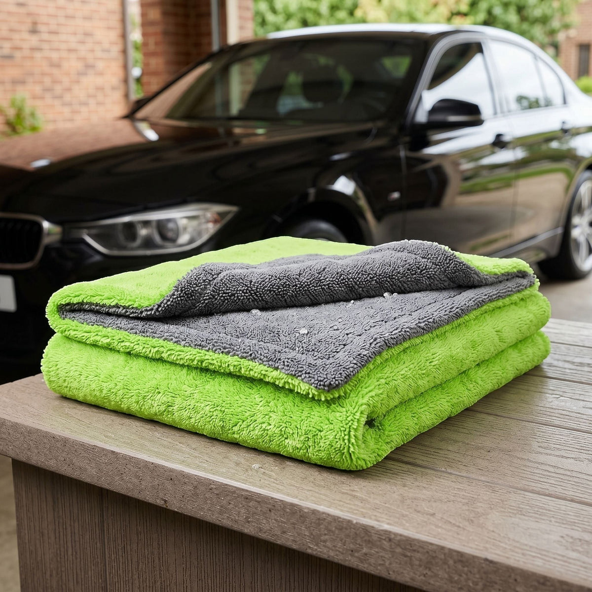 zero2cart large double-layer microfiber car drying towel in bright lime green and grey, folded on a wooden table.