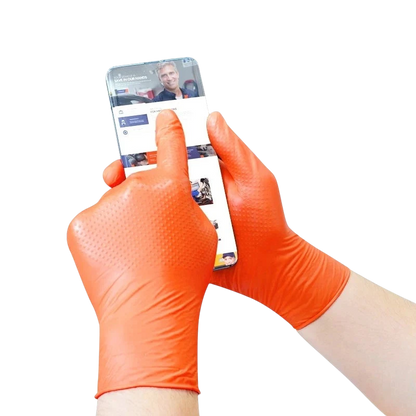 zero2cart heavy duty orange nitrile gloves with raised diamond texture being used on a smartphone
