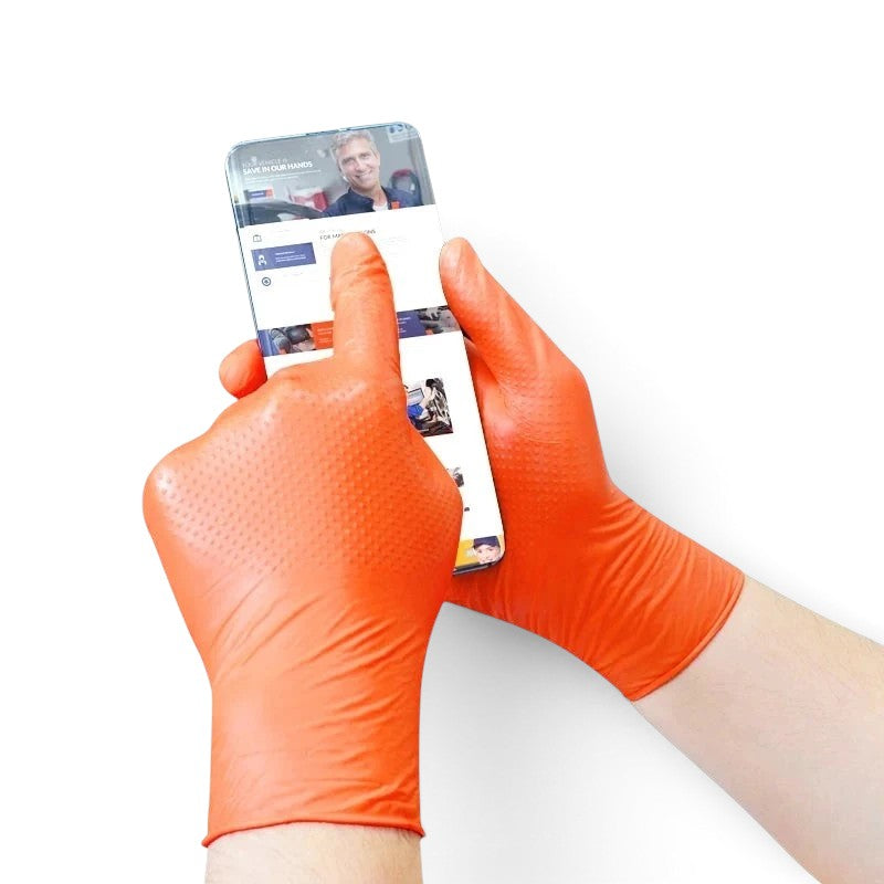 zero2cart heavy duty orange nitrile gloves with raised diamond texture being used on a smartphone