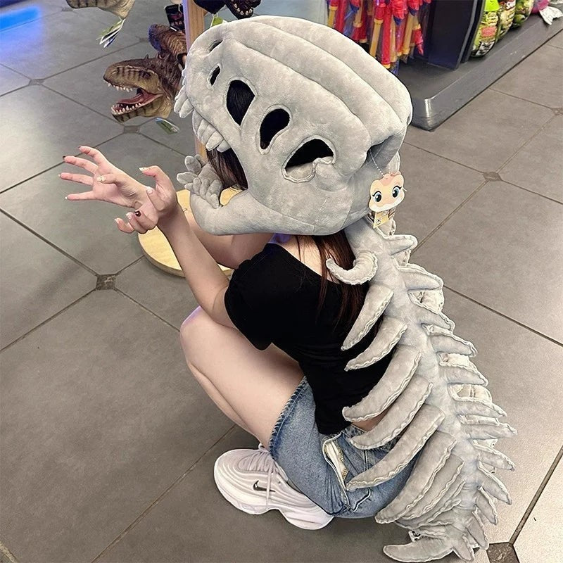 zero2cart grey plush dinosaur skeleton headgear and spine costume set worn by a person in a casual outfit