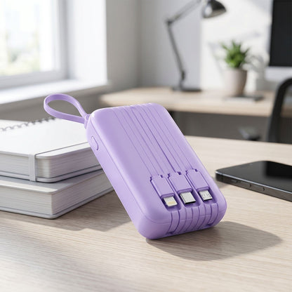 zero2cart purple portable power bank with built-in cables and a carry loop on a wooden desk