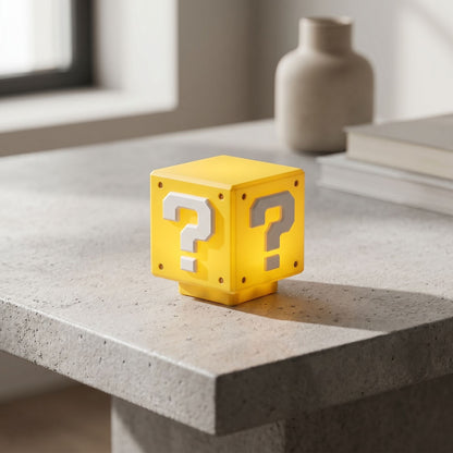 zero2cart yellow question mark brick LED night light glowing on a grey stone table in a modern room