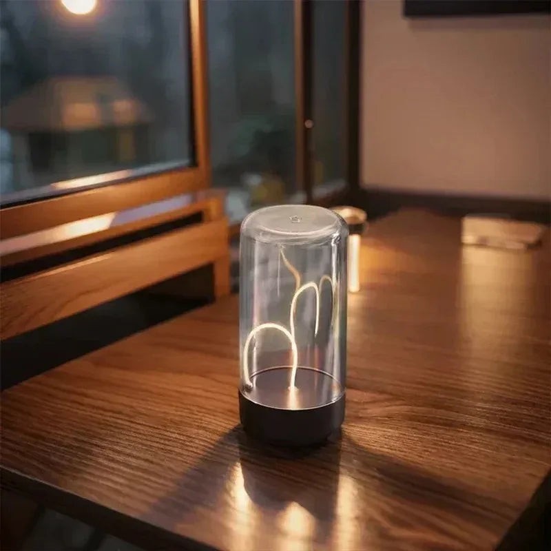 zero2cart minimalist rechargeable ambient night light with a clear cylindrical dome and warm glowing filament