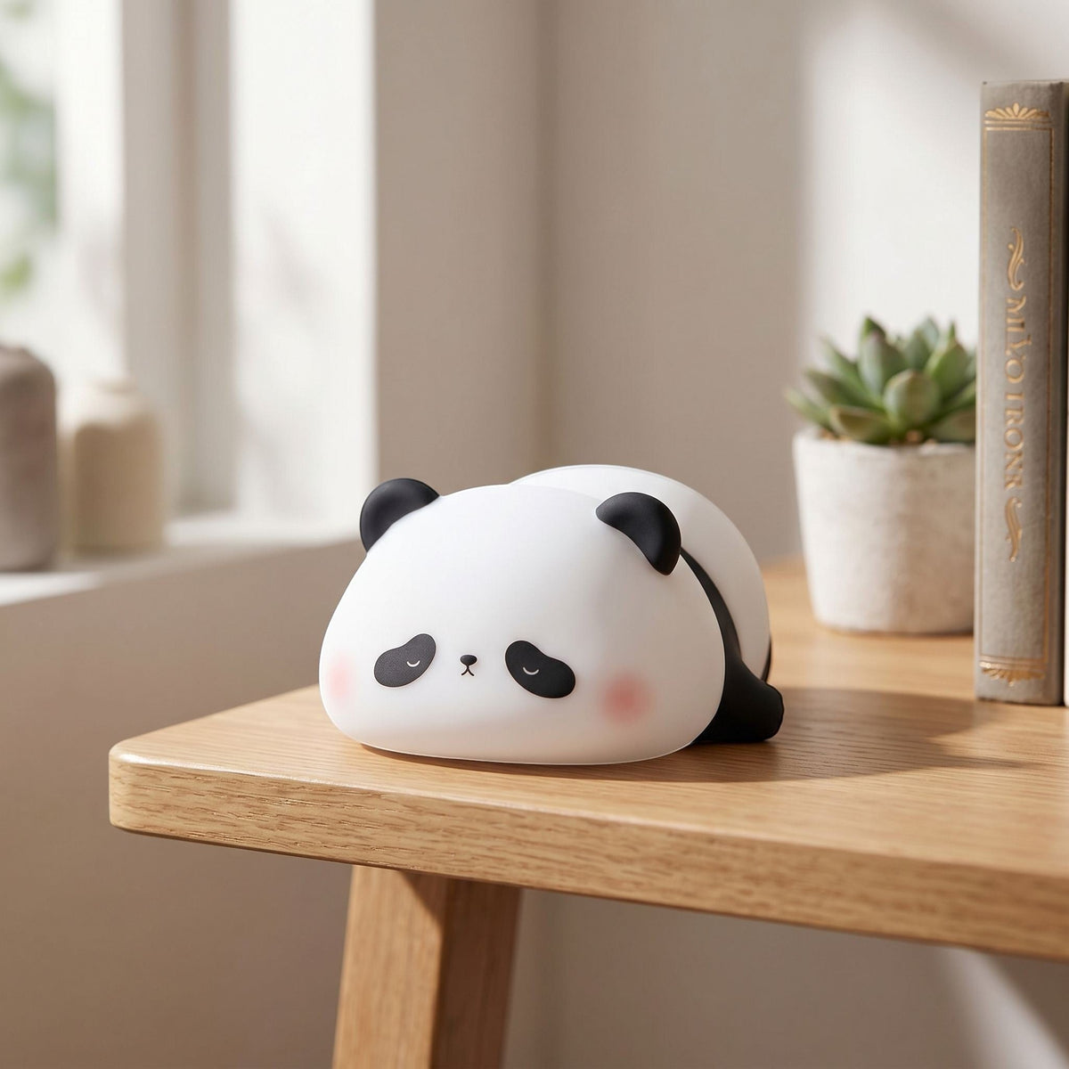 zero2cart rechargeable panda night light with a soft silicone body sitting on a wooden desk in a cozy bedroom