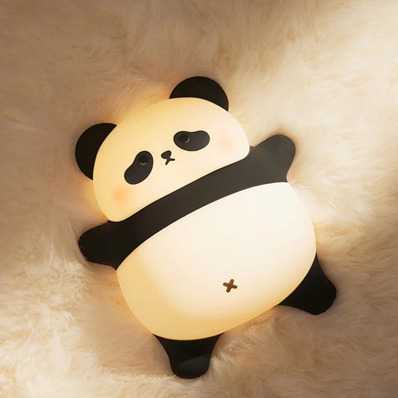 zero2cart rechargeable panda night light with soft silicone body glowing on a fluffy white surface