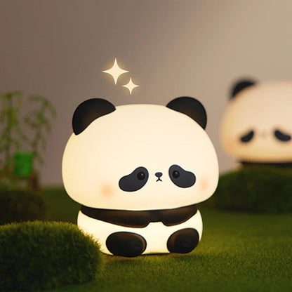 zero2cart rechargeable panda night light with soft silicone body glowing on a grassy surface