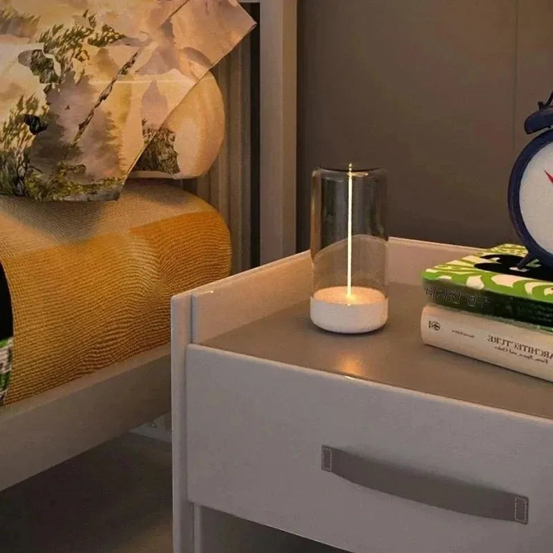 zero2cart minimalist rechargeable rectangle nightstand lamp emitting soft ambient light on a bedside table