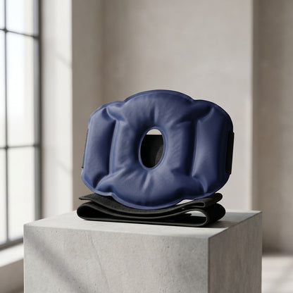 zero2cart reusable blue gel knee and elbow compression wrap with flexible cold pack on a stone pedestal