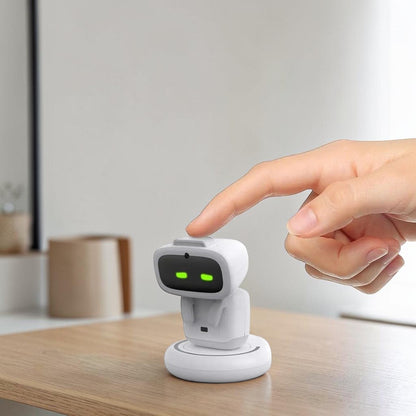 zero2cart white smart interactive robot toy with green digital eyes being touched by a finger on a white base