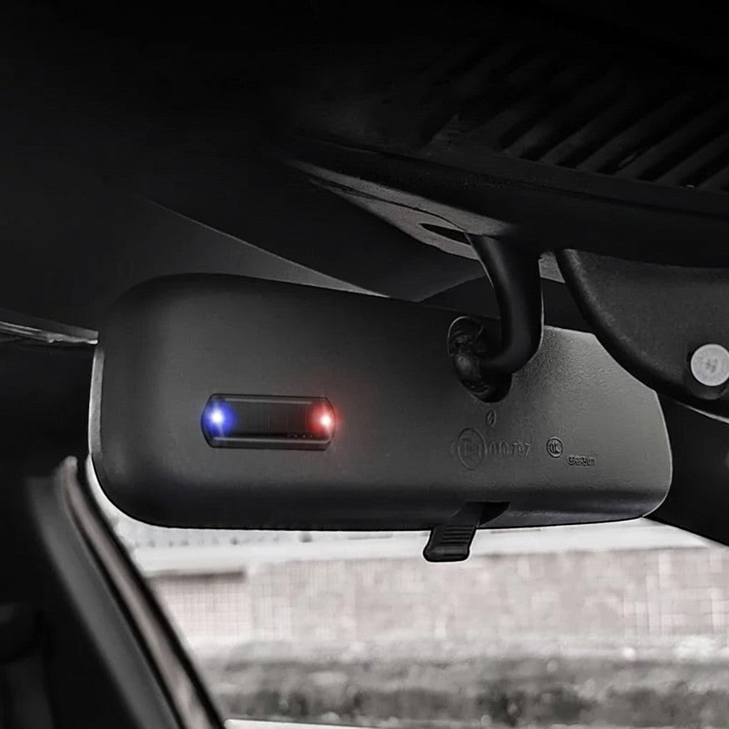 zero2cart solar car warning light with blue and red flashing LED mounted on a vehicle rearview mirror