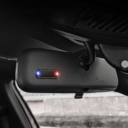 zero2cart solar car warning light with blue and red flashing LED mounted on a vehicle rearview mirror