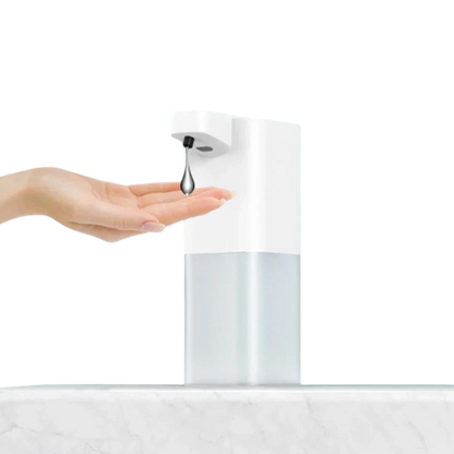 zero2cart white touchless automatic soap dispenser dispensing soap into a hand on a marble surface
