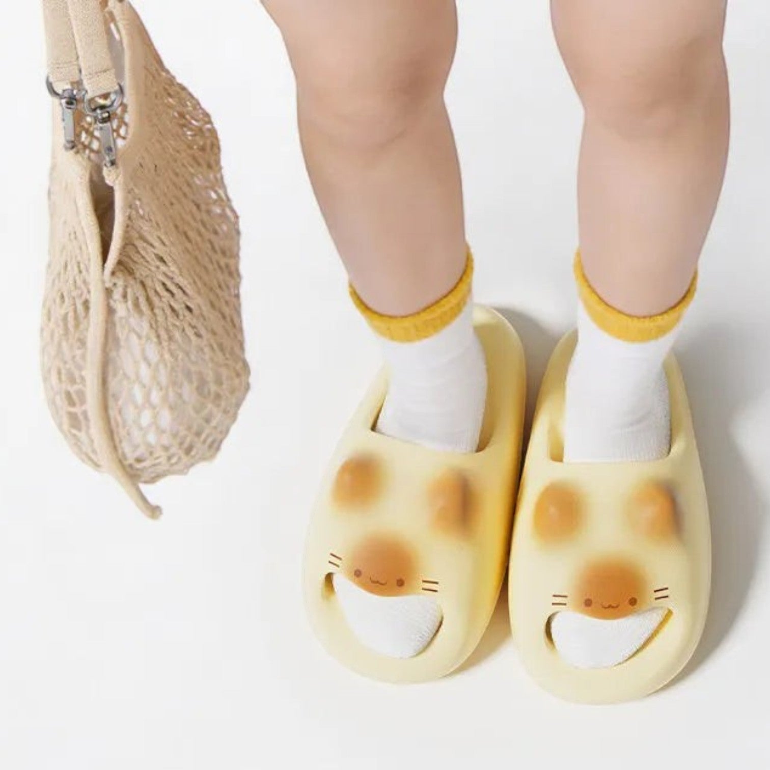 zero2cart yellow EVA cat paw summer slides featuring a cute animal face design worn with white and yellow socks