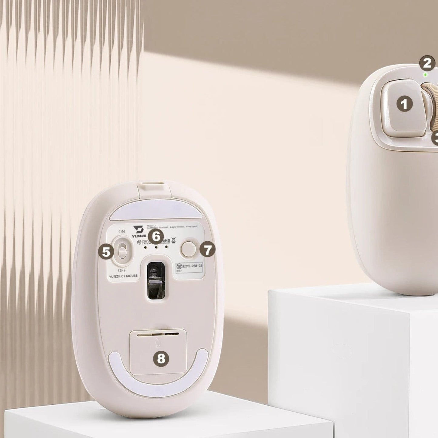 zero2cart YUNZII C1 beige silicone wireless mouse showing the underside sensor, power switch, and storage slot