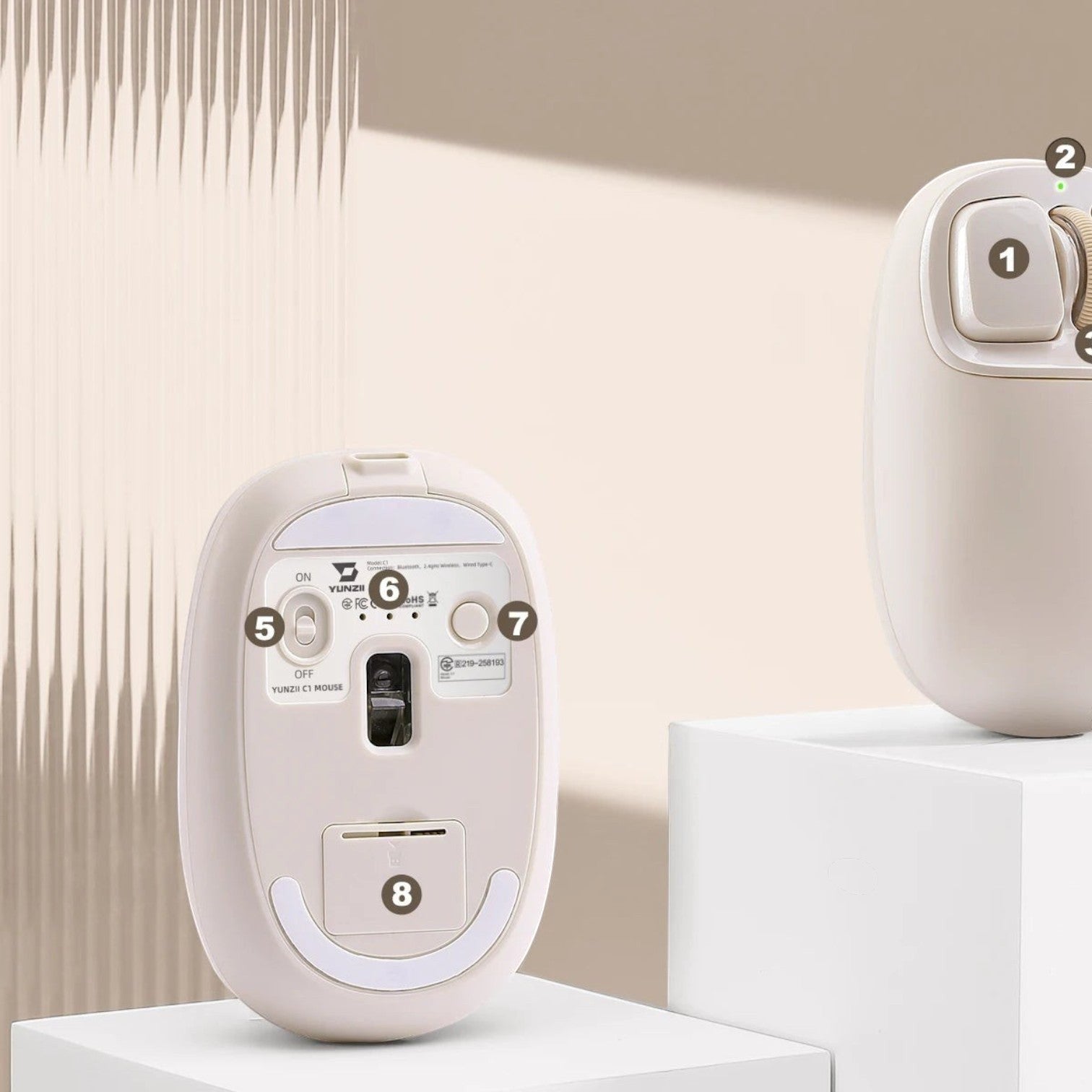 zero2cart YUNZII C1 beige silicone wireless mouse showing the underside sensor, power switch, and storage slot